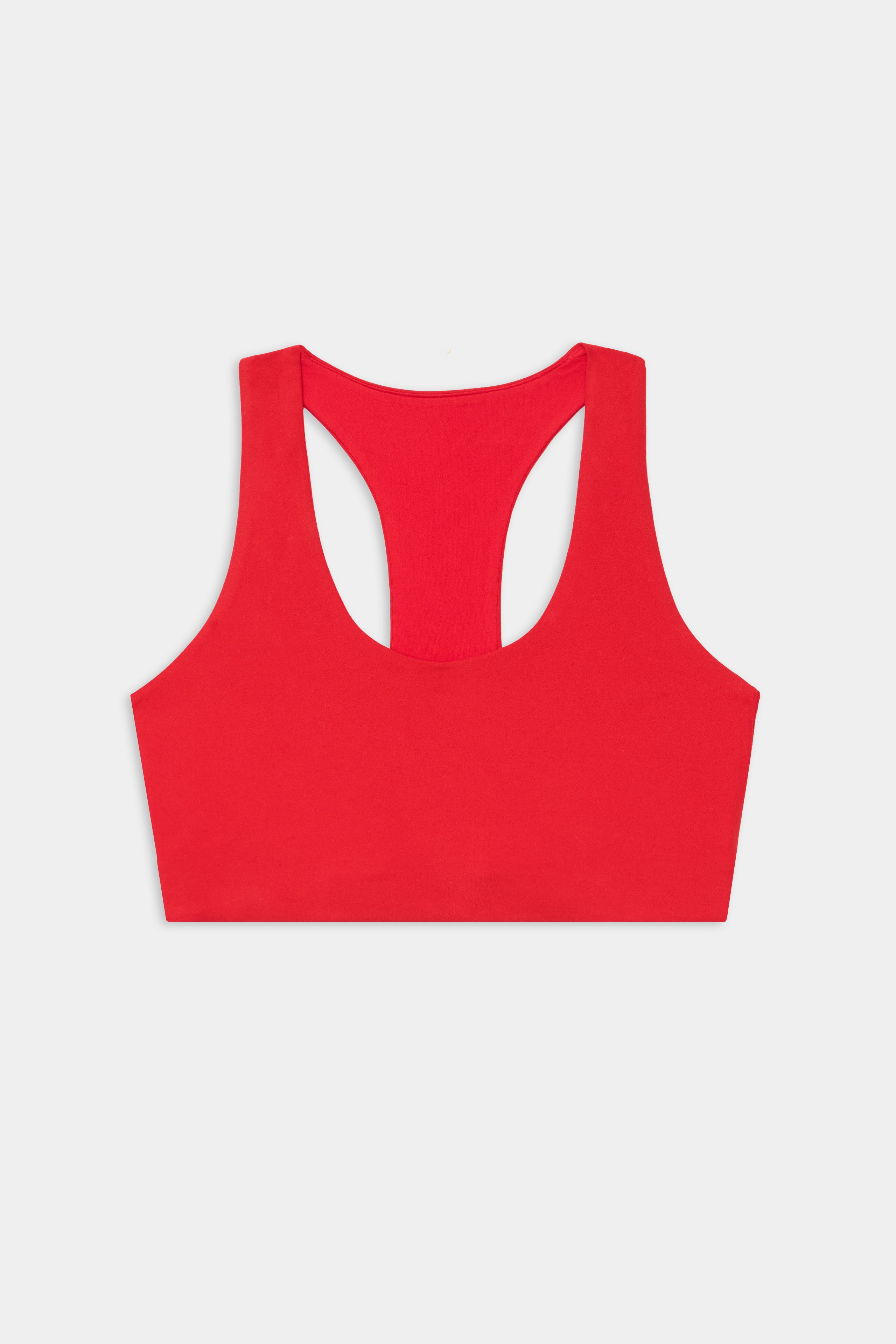 The SPLITS59 Sara Airweight Bra in Pirate Red is shown flat on a white background—ideal for Pilates or hot yoga.