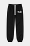 The SPLITS59 Serena French Terry Oversized Sweatpant in Black/59 features an elastic waistband with a white drawstring, elastic cuffs, and the number 59 printed in white on the left thigh. This oversized sweatpant is displayed laid flat against a plain background.