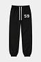The SPLITS59 Serena French Terry Oversized Sweatpant in Black/59 features an elastic waistband with a white drawstring, elastic cuffs, and the number 59 printed in white on the left thigh. This oversized sweatpant is displayed laid flat against a plain background.