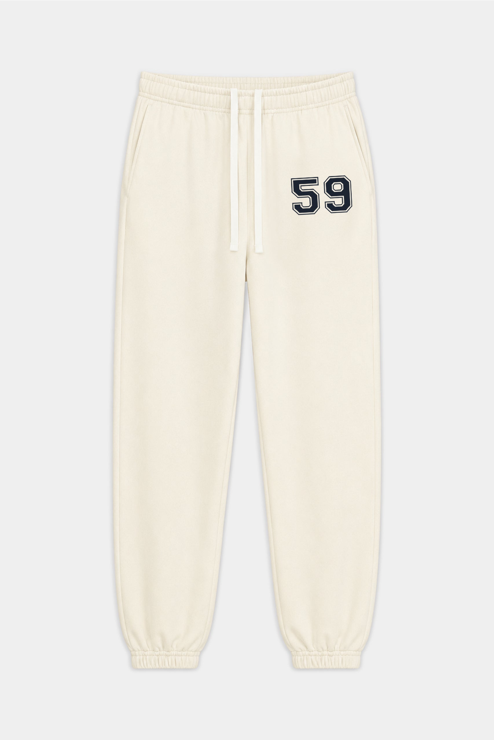 The Serena French Terry Oversized Sweatpant by SPLITS59 in Creme/59 is crafted from soft 100% cotton, featuring an elastic waistband, drawstring, cuffed ankles, and a black and white “59” detail on the left thigh.