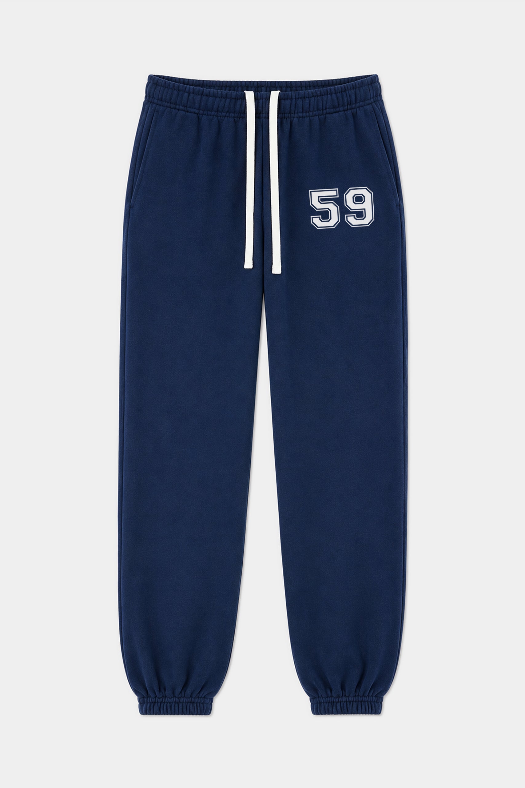 The Serena French Terry Oversized Sweatpant by SPLITS59 features an indigo blue color, crafted from 100% cotton with a white drawstring, elastic cuffs, and the number 59 printed on the left thigh.