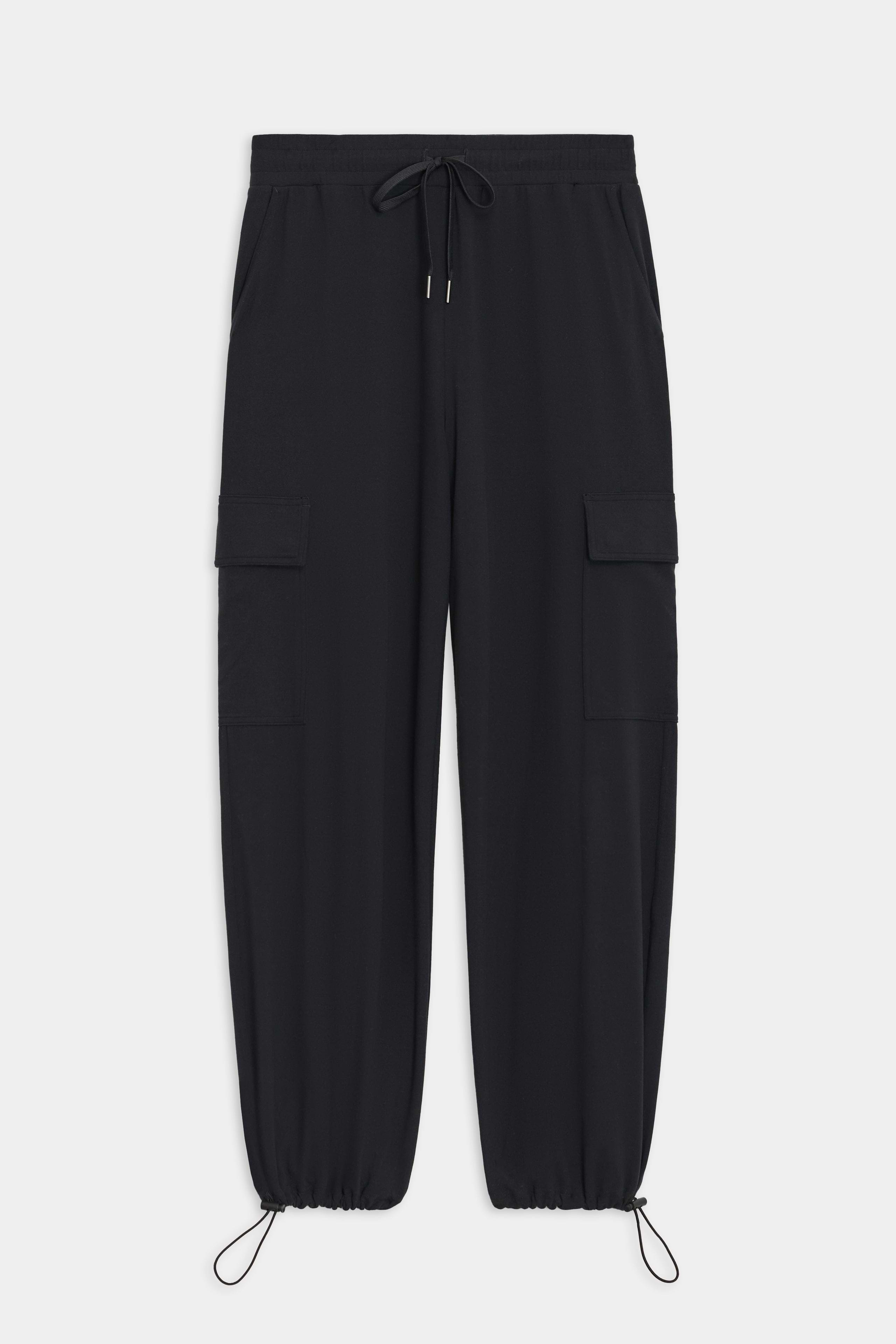 The Nico Airweight Cargo Pant by SPLITS59, in black, features a relaxed fit with side pockets and elastic cuffs. Made of lightweight Airweight fabric, these pants offer ultimate comfort and style for everyday wear, displayed flat on a white background.
