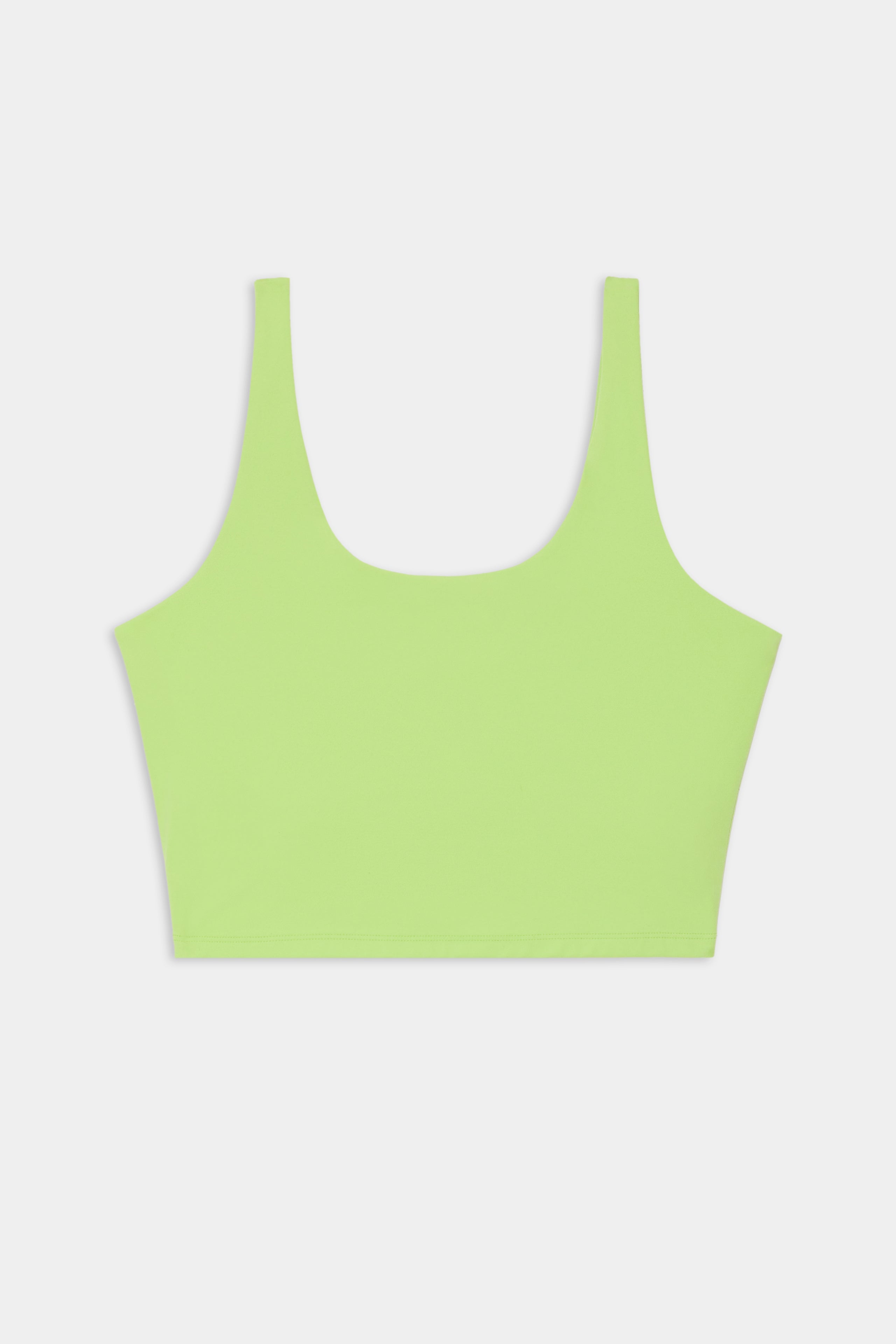 A SPLITS59 Sprint Rigor Bralette in Limeade, featuring wide shoulder straps and an ultra-light design for multi-sport performance, displayed on a plain white background.