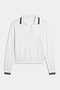 The SPLITS59 Taylor Knit Polo in White/Black is a long-sleeve sweater featuring a V-neck and black double stripes on the collar and cuffs, crafted from soft, breathable fabric and shown laid flat on a white background.