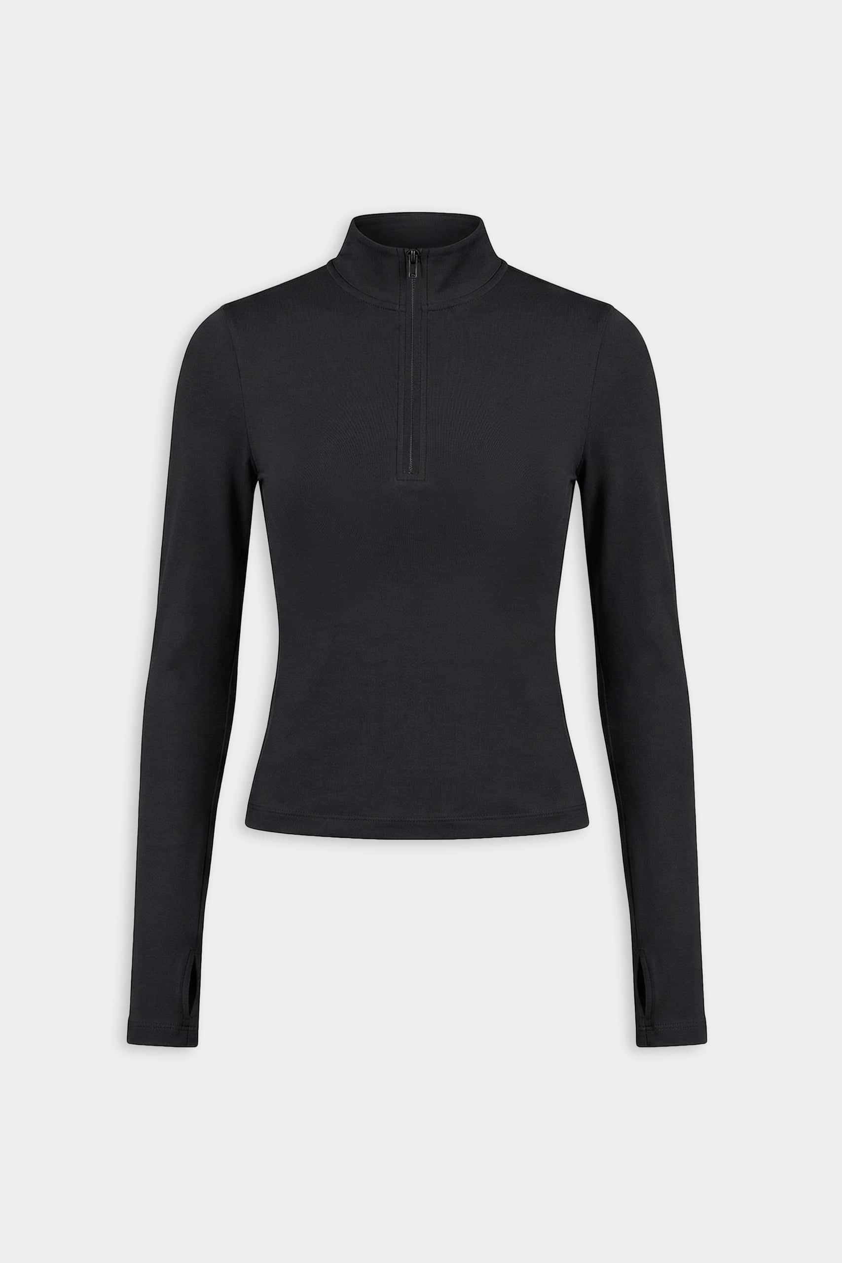 The SPLITS59 Tess Rigor Half Zip Waist Length in black is a women’s long-sleeve top with a mock neck and front half-zip, made from a soft nylon-spandex blend, shown laid flat on a white background.