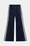 The SPLITS59 Heritage Velour Pant in Indigo/White features wide-leg styling, soft polyester-spandex fabric, and distinctive white double side stripes along the outer seams.