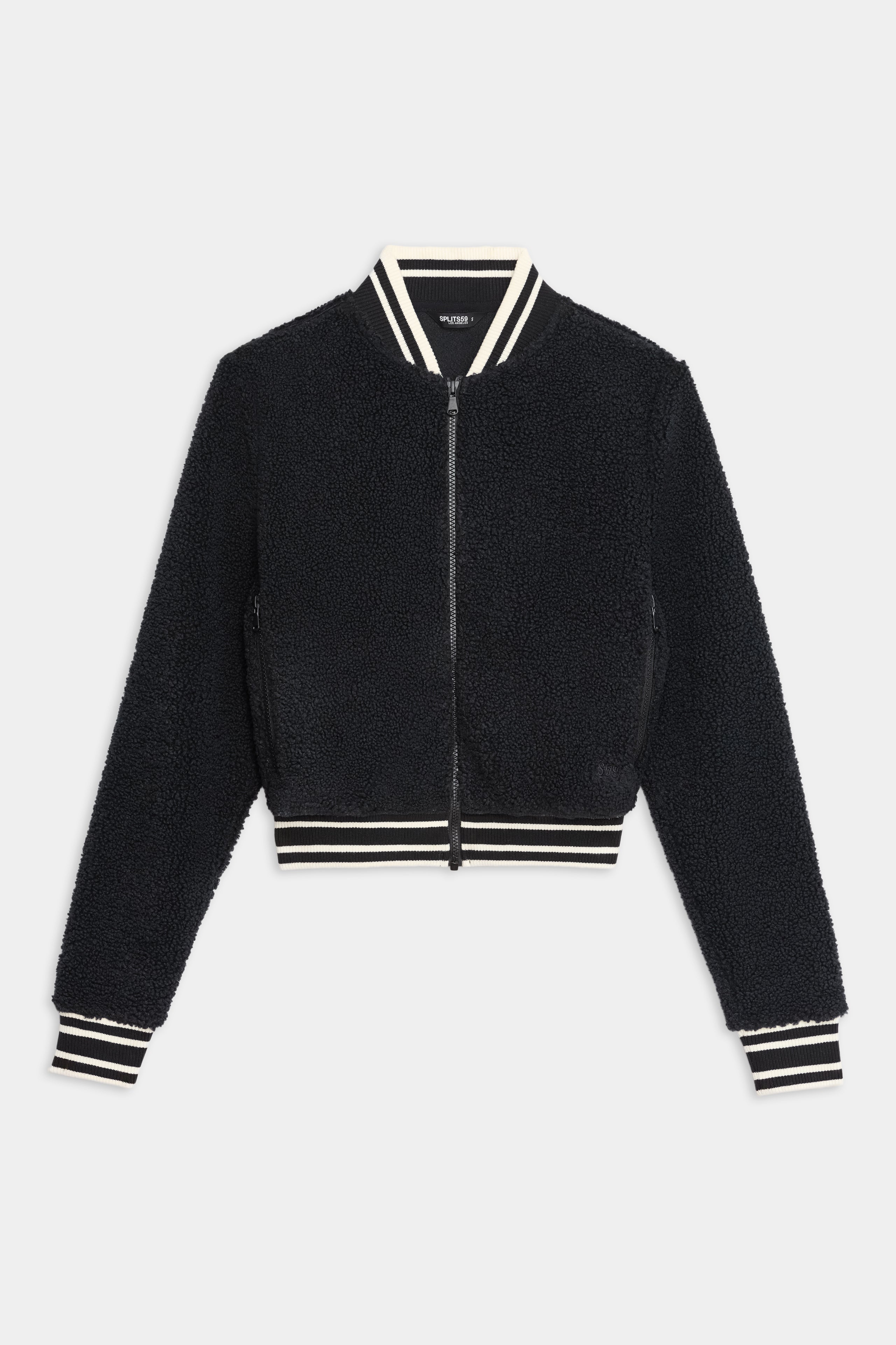 The SPLITS59 Willa Sherpa Jacket - Black is a cozy baseball-style bomber with a front zipper and white-striped ribbed trim—ideal for winter workouts. Shown here against a white background.