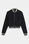 The SPLITS59 Willa Sherpa Jacket - Black is a cozy baseball-style bomber with a front zipper and white-striped ribbed trim—ideal for winter workouts. Shown here against a white background.