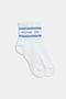 The SPLITS59 Logo Stripe Quarter Socks in White/Skylight feature a blue stripe and the brand's logo near the top, offering a classic retro athletic look.
