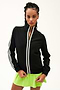 Front view of girl wearing black zip jacket that stops under chin with two white stripes down the side and the front with a green skirt