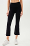 A woman wearing SPLITS59's Raquel High Waist Crop leggings in black and a white tee.