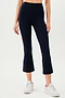 A woman wearing black SPLITS59 Raquel High Waist Crop leggings and white sneakers.