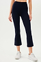 A woman wearing black SPLITS59 Raquel High Waist Crop leggings and white sneakers.