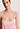 Close-up view of a women model wearing HA coral pink cotton Spaghetti Dress 90cm