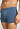 Close-up view of a men model wearing HA tanzanite melange modal/viscose/tencel Pants