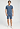 Full-body view of a men model wearing HA tanzanite melange modal/viscose/tencel Short Pants
