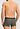 General view of a men model wearing HA charcoal art / smokey olive cotton Pants 2Pack