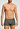 Front view of a men model wearing HA charcoal art / smokey olive cotton Pants 2Pack