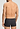 General view of a men model wearing HA charcoal art / smokey olive cotton Pants 2Pack
