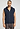 Front view of a men model wearing HA deep navy cotton Zippered vest