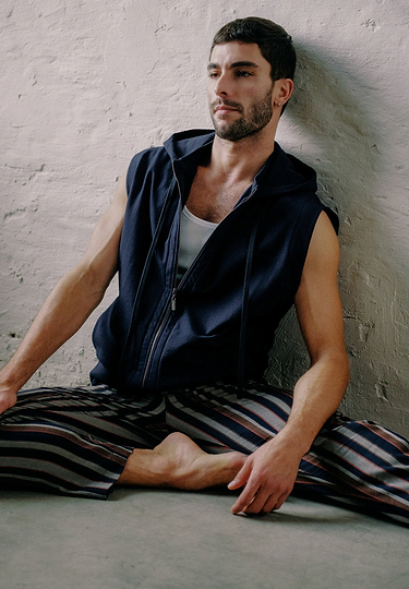 General view of a men model wearing HA deep navy cotton Zippered vest