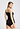 Back view of a women model wearing HA black cotton Spaghetti Top