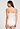 Back view of a women model wearing HA off white cotton Spaghetti Top