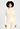 Front view of a women model wearing HA vanilla silk Turtle-Neck Shirt