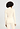 Back view of a women model wearing HA vanilla silk Turtle-Neck Shirt