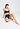 Full-body view of a women model wearing HA deep navy microfibre Crop Top