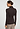 Back view of a women model wearing HA dark mocha modal/viscose/tencel Turtle-Neck Shirt