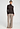 Full-body view of a women model wearing HA dark mocha modal/viscose/tencel Turtle-Neck Shirt