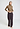Full-body view of a women model wearing HA suede camel modal/viscose/tencel Turtle-Neck Shirt
