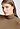 Close-up view of a women model wearing HA suede camel modal/viscose/tencel Turtle-Neck Shirt