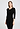 Front view of a women model wearing HA black wool 3/4 SLV Shirt