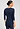 Back view of a women model wearing HA deep navy wool 3/4 SLV Shirt