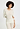 Front view of a women model wearing HA misty white wool 3/4 SLV Shirt
