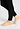 Close-up view of a women model wearing HA black wool Leggings