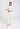 Full-body view of a women model wearing HA misty white wool S/SLV Shirt