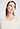 Close-up view of a women model wearing HA misty white wool S/SLV Shirt