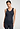 Front view of a women model wearing HA deep navy wool Tank Top