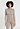 Front view of a women model wearing HA rose grey wool Turtle-Neck Shirt
