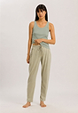 Full-body view of a women model wearing HA green tea cotton Tank Top