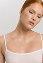Close-up view of a women model wearing Hanro white cotton Spaghetti Top