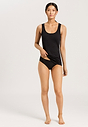 Full-body view of a women model wearing HA black cotton Tank Top