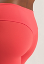 Close-up view of a women model wearing HA juicy melon microfibre Leggings