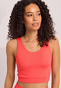 Close-up view of a women model wearing HA juicy melon microfibre Tank Top