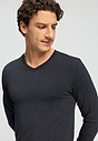Close-up view of a men model wearing HA charcoal melange modal/viscose/tencel L/SLV Shirt V-Neck