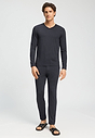 Full-body view of a men model wearing HA charcoal melange modal/viscose/tencel Long Pants