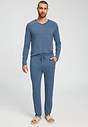 Full-body view of a men model wearing HA tanzanite melange modal/viscose/tencel Long Pants